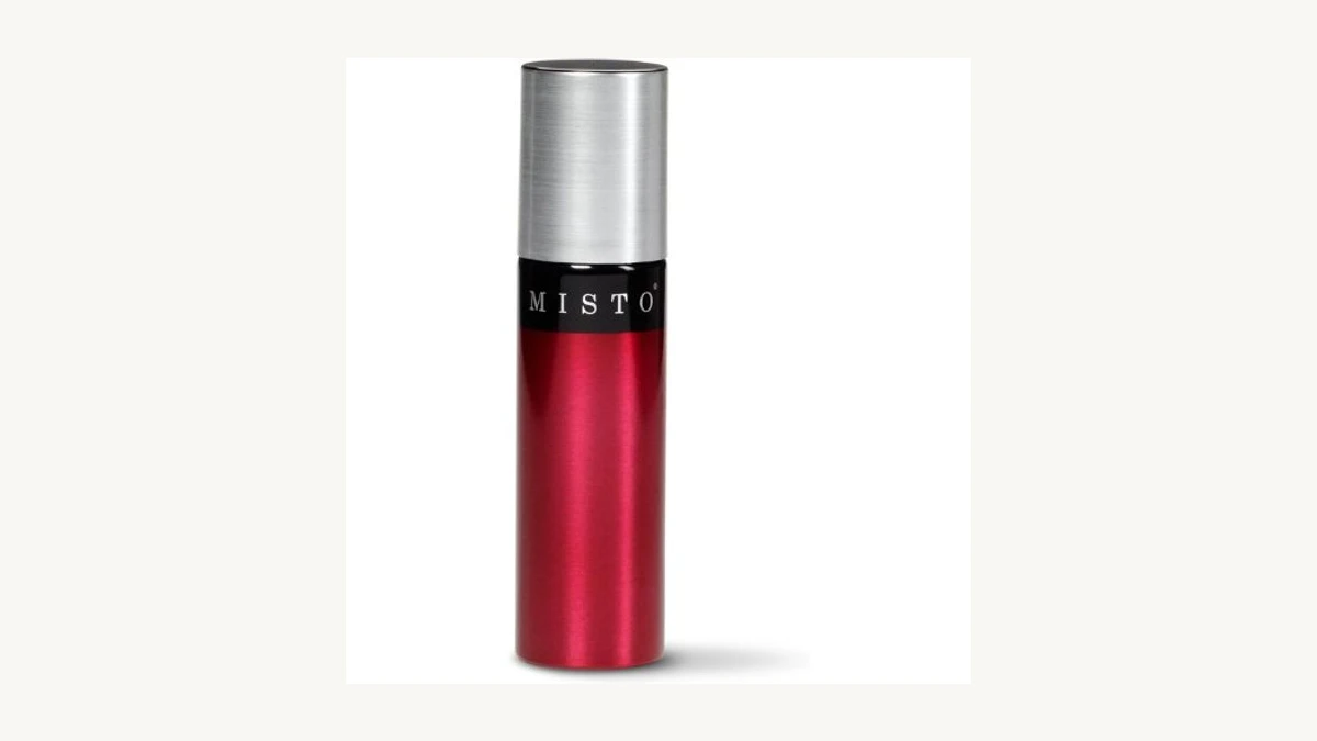 Misto Brushed Aluminum Oil Sprayer bottle standing elegantly on a wooden cutting board