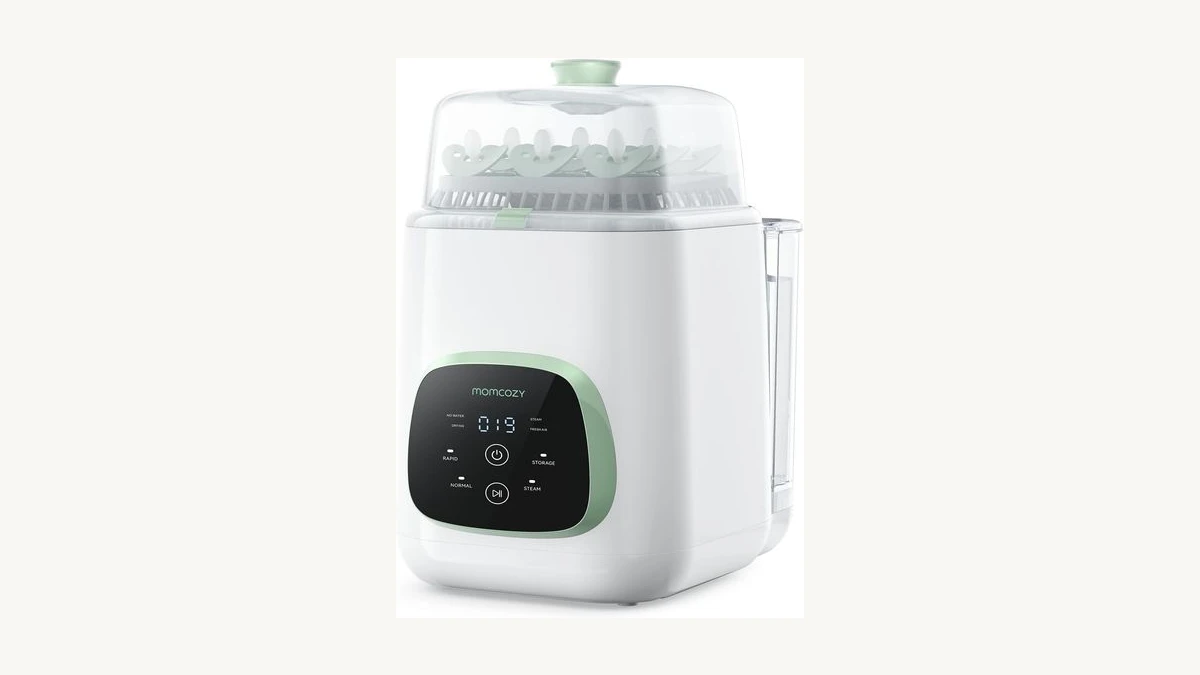 Momcozy KleanPal Pro All-in-One Bottle Washer Sterilizer and Dryer on a modern countertop