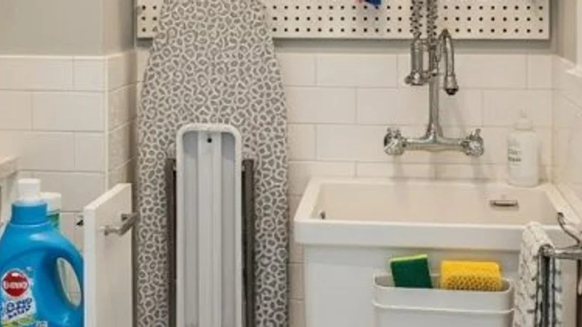 Mustee Utilatub Laundry Tub standing firmly on heavy-duty floor mounts with laundry accessories