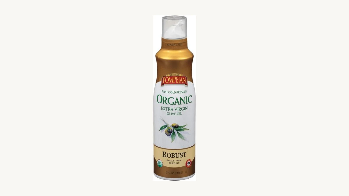 Pompeian Organic Extra Virgin Olive Oil Spray bottle on a light breakfast kitchen background