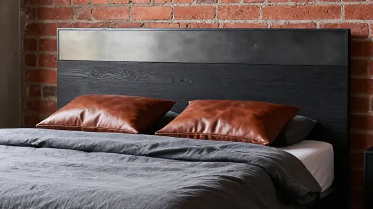 A mid-century modern tapered-leg wood bed frame
