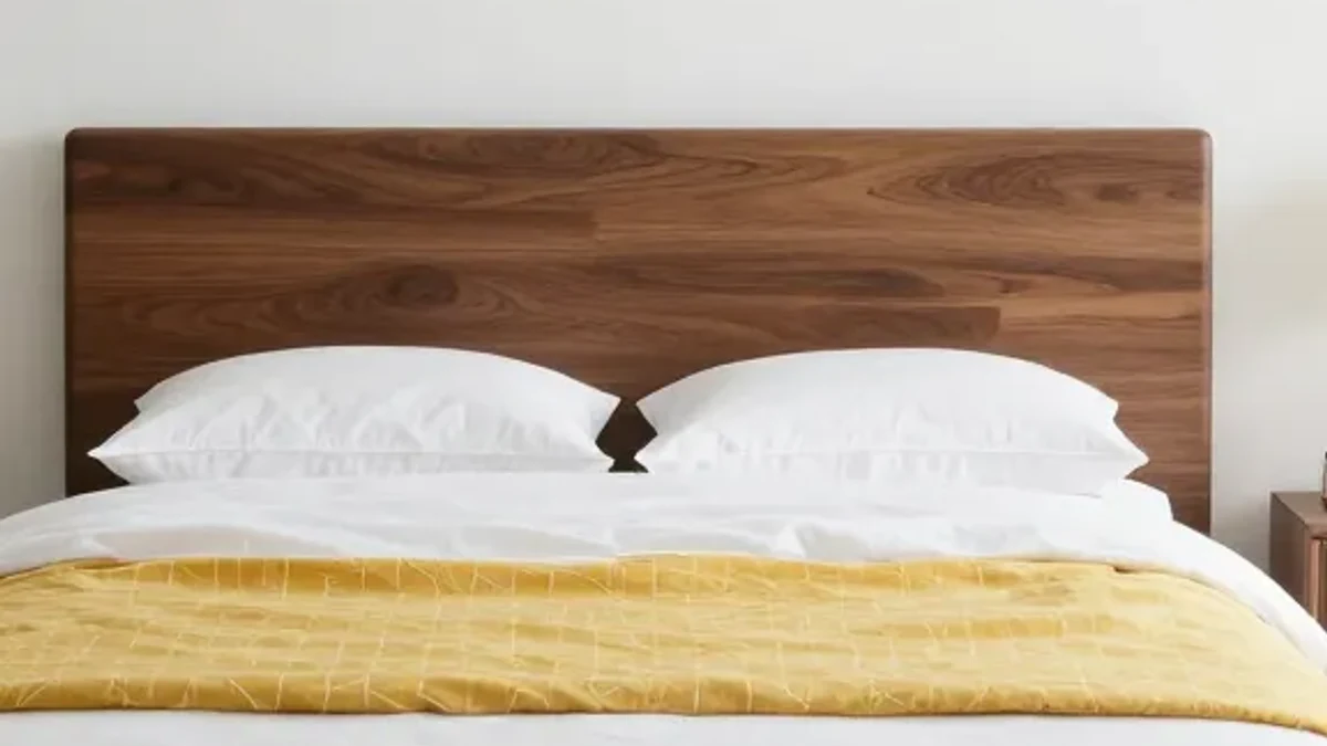 A sleek platform bed in dark walnut for modern minimalism
